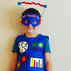 a young boy wearing a blue costume and mask