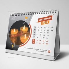 a desk calendar with candles on it