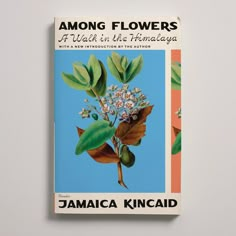 a book with an image of flowers on the front and back cover that reads among flowers