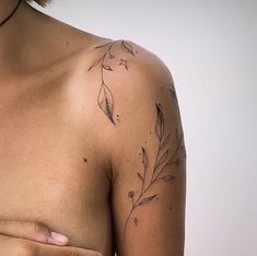 a close up of a person's chest with leaves on it