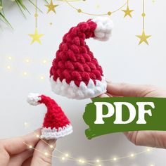 two hands holding small knitted santa hats with the text free crochet pattern