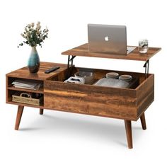 a wooden desk with drawers and a laptop on top