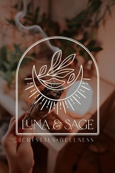 the logo for luna & sage, a specialty winehouse that is open to business