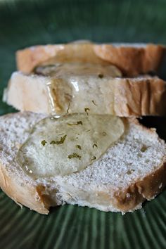 two pieces of bread on a green plate