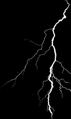 a black and white photo of lightning strikes