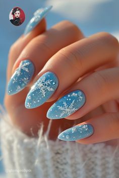 Get ready to steal some spotlight with our ice-blue themed nail designs this frosty season! Delicate white snowflake accents add another layer of wintry elegance while showcasing superb detailing skills, perfectly nestled against an enchanting backdrop inspired by freshly fallen radioatively radiant snow under a crisp clear sky. Unleash their dazzling charm wherever you go…#ReadyToDazzle #IceBlueNails #SnowfallMagic Snow Flake Nails Design Blue, Icy Blue Snowflake Nails, White And Blue Nails Winter, Christmas Acrylic Nails Blue, Baby Blue Xmas Nails, Light Blue Frosty Nails, Winter Frost Nails, Ice Themed Nails, Ice Blue Christmas Nails