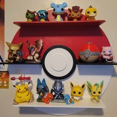 pokemon figurines are sitting on top of a cd case with other pikachu figures