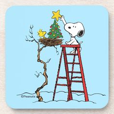 a charlie brown christmas tree on top of a red ladder with a star in it