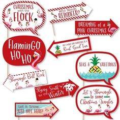 red and white christmas photo booth props with flamingo, snowflakes, pineapples