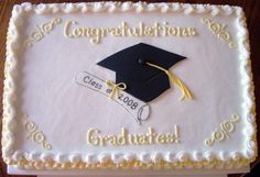 a graduation cake with congratulations written on it