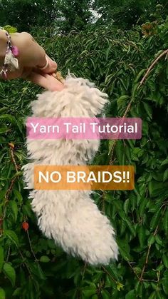 a person is holding a stuffed animal up to the camera with text overlay that reads yarn tail tutor no braids