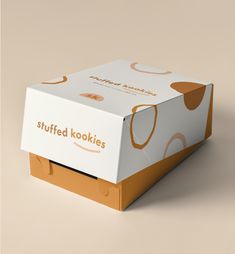 an opened box with the lid closed on a beige background that says stuffed kookikes