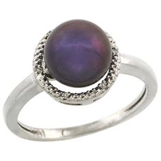 a ring with a purple pearl in the center and silver beads on it's sides