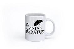 a white coffee mug with the words in omnia paratus on it and an umbrella