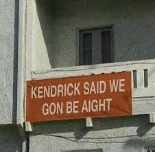 a sign on the side of a building that says, kentucky said we go be alright