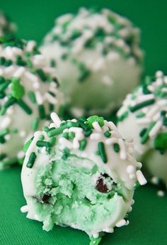 green and white cake balls with sprinkles on them