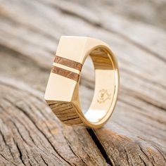 a wooden ring with two stripes on it