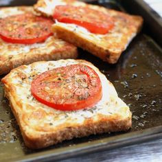 three slices of toast with tomatoes on them