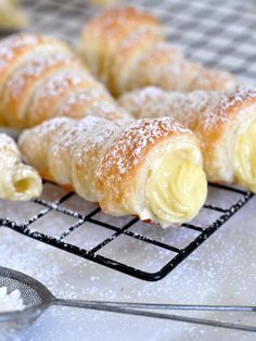 pastries on a cooling rack with powdered sugar