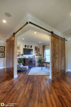 an open living room with wood floors and sliding doors