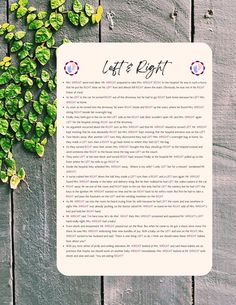 a piece of paper sitting on top of a wooden table next to green leaves and flowers