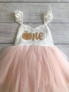 "♥ Product Information 100% Cotton in bodice and lining 100 % polyester tulle skirt Do not bleach Color is an Off White for the top and light pink for the tutu. Pumpkin age one is a gold color on the dress. Toddler tutu dress 's elastic back has a small loop to tie the strap crossover, adjust the length accordingly for a comfortable fit Beautiful baby dress has 4 layers exquisite fine tulle on the skirt with cotton lining to protect toddler girls gentle skin; Double layer front bodice with sweat Cute Sleeveless Tutu Dress With Tulle Skirt, Spring Princess Cream Tutu Dress, Summer Tulle Princess Dress For Birthday, Princess Style Cream Tutu Dress For Spring, Cute Peach Party Dress, Summer Princess Dress With Lace Bodice, Spring Pink Tutu Dress With Lace Bodice, Spring White Tutu Dress With Lace Bodice, Cream Princess Dress With Tulle Skirt For Party