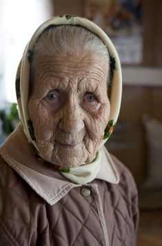 an old woman with a hood on her head