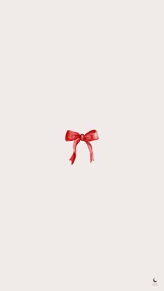 a red ribbon tied to the side of a white wall