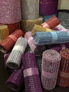 many rolls of colorful sequinized mesh