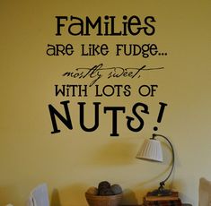 a wooden sign that says families are like fudge not by sweet with lots of nuts