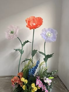 an arrangement of colorful flowers in a vase