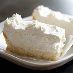 two pieces of cake sitting on top of a white plate