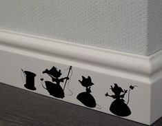 the silhouettes of mice are on the wall