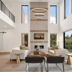 a modern living room with high ceilings and large windows