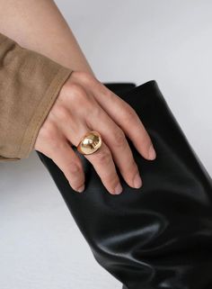 Get ready to stack with the Chantae Dome Ring Gold! This sleek curved dome ring is a must-have staple for your accessories game. Wear it alone or mix and match for a unique look. Don't miss out on this versatile and stylish addition to your collection! Finish: 18k PVD plating, tanrish free