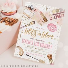 a pink box filled with cupcakes and other items next to a birthday card