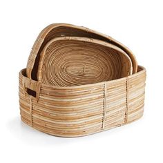 three woven baskets are stacked on top of each other in the shape of an oval basket