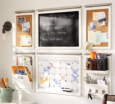 a chalkboard with writing on it is attached to the wall next to a desk