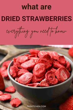 strawberries in a bowl with the words, what are dried strawberries? everything you need to know