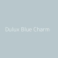 the words dulux blue charm on a gray background