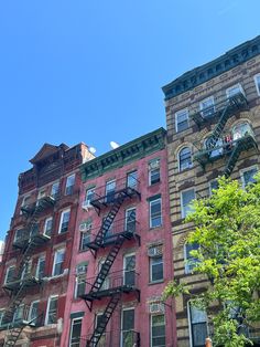 an apartment building with several balconies and fire escapes