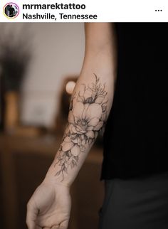 a person with a flower tattoo on their arm