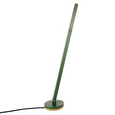 a green floor lamp on a white background