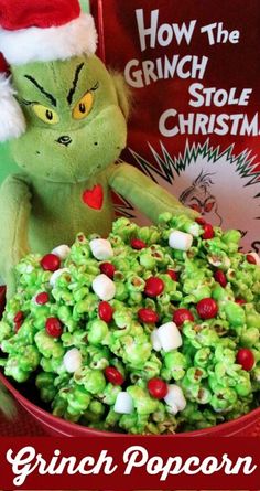 a grinch popcorn christmas treat in a red bowl