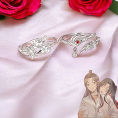 💍 Divine Design: Inspired by the popular anime Tian Guan Ci Fu, these rings feature the characters Hua Cheng and Xie Lian. -Perfect Gift: These rings make an ideal gift for fans of the anime, suitable for any occasion. -Unisex Style: Designed to be worn by both men and women, these rings are a great way to show your love for the anime. 📏 Adjustable Size: The rings are adjustable, ensuring a comfortable fit for any finger size. 🎨 Detailed Craftsmanship: Each ring is carefully crafted, showcasi Jewelry Hua Cheng, Anime Engagement Rings, Anime Rings, Anime Wedding, Hua Cheng, Divine Design, Popular Anime, Matching Rings, Unisex Ring