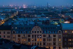 the city skyline is lit up at night