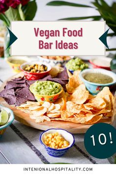 a plate with chips, guacamole and salsa on it that says vegan food bar ideas