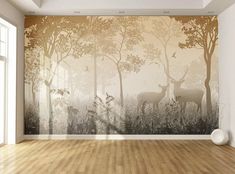 an empty room with a deer mural on the wall and wood flooring in front of it