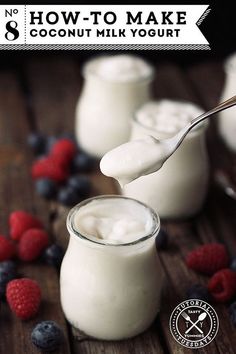 a spoon with yogurt and berries in it