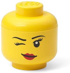 a yellow plastic container with a face on it